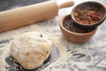 Raw dough with chocolate chips on table