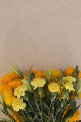 Yellow carnations and ranunculus
