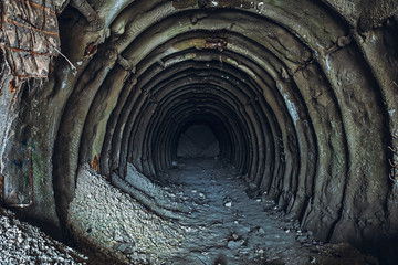 Underground ruined and abandoned chalk mine tunnel or industrial corridor with perspective view