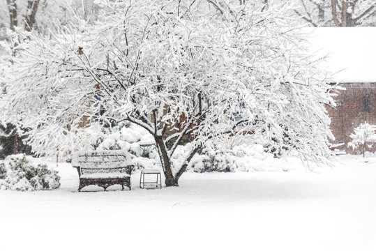 Outdoor furniture covered with snow