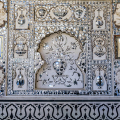 Ancient fortress, Amer fort, Shish Mahal, architectural detail, Jaipur, Rajasthan, India. Historic Amber fort, beautiful Chamber of Thousands Mirrors, decorated with mirror tiles.