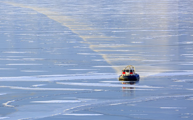 A hovercraft rides on the ice of lake Baikal