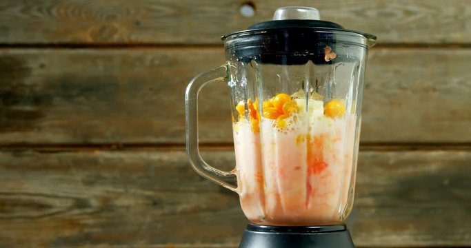 Fruit juice being grind in juicer 
