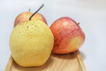 chainese pear and Apples on wooden tray