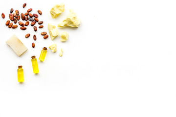 Cocoa butter as ingredient for natural cosmetics. White background top view copy space