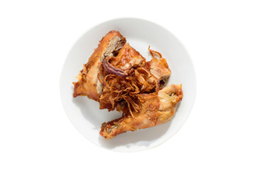 Fried chicken leg with fried onion on top isolated on white background