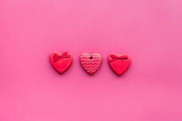 Heart shaped cookies for Valentine's Day on pink background top view copy space