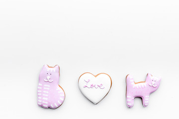 Valentine cookies. Hearts with lettering I love you, cat and puppy on white background top view space for text