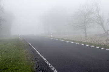 Fototapeta na wymiar German rural street during foggy weather