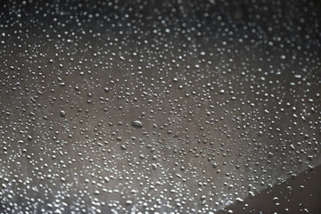 rain water drops on the window black color