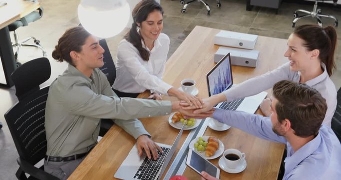Executives working together at desk 