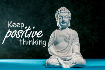 Keep Positive thinking - motivating message concept with Little Buddha statue. Think positive, be...