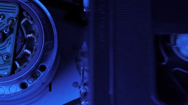 rewind of videotape in the VCR mechanism.The sequence of video footage. magnetic head in the VCR mechanism. Videorecorder S-VHS, VHS. 4k
