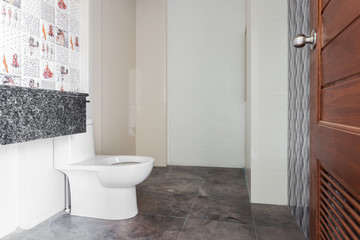 Fototapeta na wymiar Modern design home bathroom White sanitary ware in the bathroom. Under construction