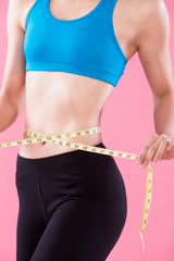 woman take waist scale