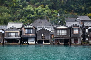 Fototapeta premium Ine Boathouse is traditional Fisherman Village on a rainy day of Kyoto, JAPAN.