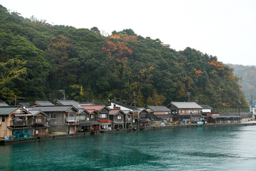 Fototapeta na wymiar Ine Boathouse is traditional Fisherman Village on a rainy day of Kyoto, JAPAN.