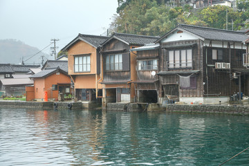 Fototapeta na wymiar Ine Boathouse is traditional Fisherman Village on a rainy day of Kyoto, JAPAN.