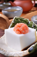 Tofu with  soya sauce on the bowl