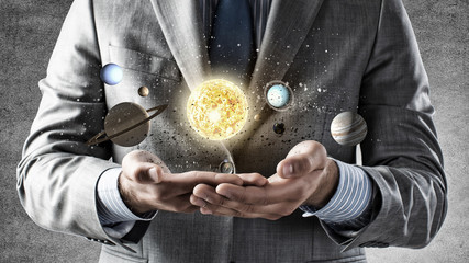 Solar system in hands © Sergey Nivens