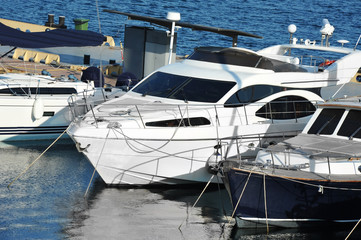 Naklejka na ściany i meble Motor yacht in jetty
