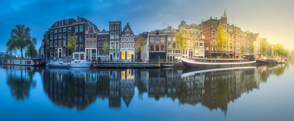 River, canals and traditional old houses Amsterdam - obrazy, fototapety, plakaty