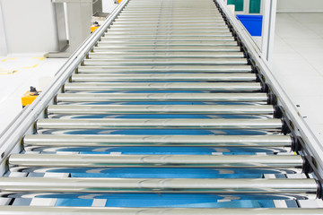 The conveyor chain, and conveyor belt on production line set up in clean room area.