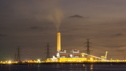 Fototapeta premium power plant by the sea in twilight view