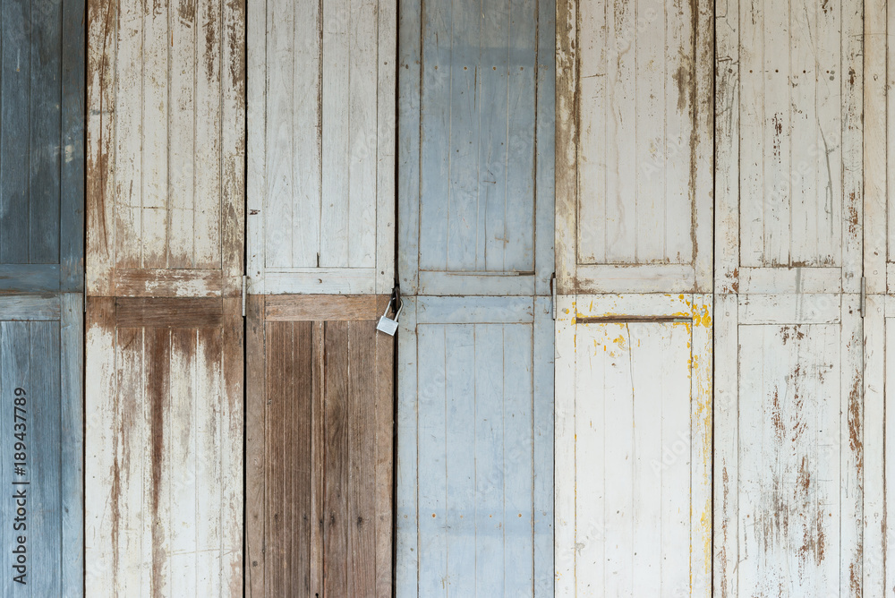 Wall mural antique old wooden wall and door in Thailand.