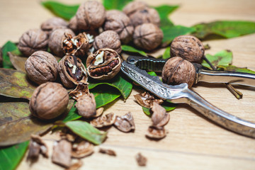 Several walnut kernels and lie on brown background