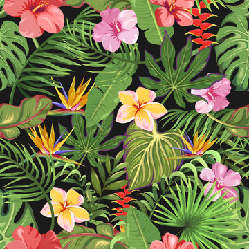 A seamless pattern with different tropical flowers and leaves. Exotic palms and flowers