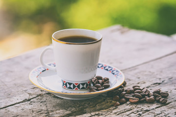 Cup of coffee on a wooden surface
