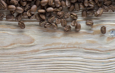 roasted coffee beans on wood texture