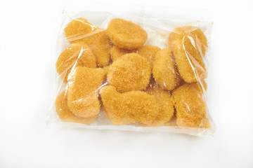 chicken nuggets in the package, isolated on white background