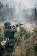 Soldier Wehrmacht shoots with a rifle