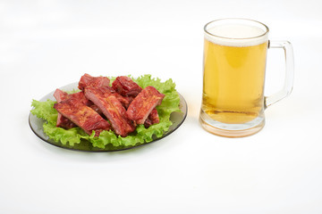 Roasted pork ribs and beer isolated on white background