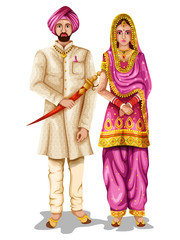 Punjabi wedding couple in traditional costume of Punjab, India