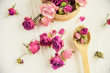 Dried rose petals: for tea, alternative medicine, pot-pourri. Copy space.