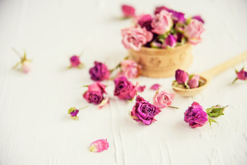 Obraz na płótnie Canvas Dried rose petals: for tea, alternative medicine, pot-pourri. Copy space.