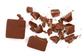 Chocolate pieces isolated on white. Top view. Flat lay