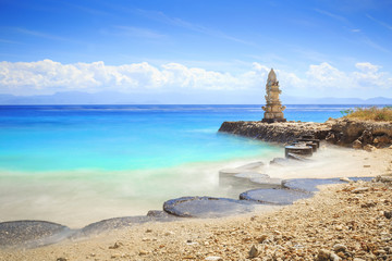 Small Temple on the Shore by the Sea on Nusa Penida with blue sky above Bali, Indonesia