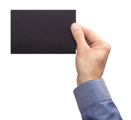 Mockup A6 empty blank black postcard horizontally holds the man in his hand in shirt. Isolated on a white background