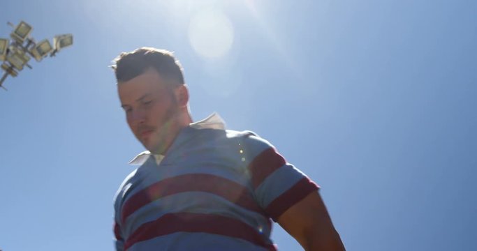 Rugby player doing spot jogging on a sunny day  