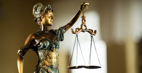 Law and Justice concept. Mallet of the judge, books, scales of justice.  Courtroom theme.
