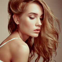 Fototapeta premium Portrait of young beautiful girl with blonde hair. Fashion photo Hairstyle. Make up. Vogue Style