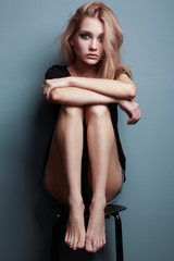 Fototapeta premium Portrait of young beautiful girl with blonde hair. Fashion photo Hairstyle. Make up. Vogue Style.