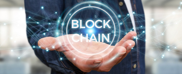 Businessman using blockchain cryptocurrency interface 3D rendering