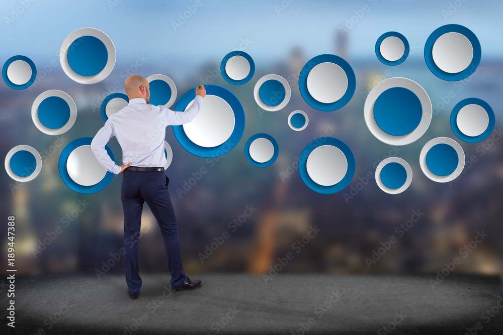 Poster businessman in front of a wall with empty app interface made of blue button displayed on a interface