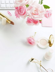 Flat lay, top view feminine desk, female make up accessories and bouquet roses.Beauty blog , Holiday concept.Copy space