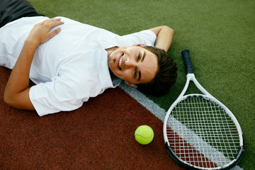 Happy Man Relaxing After Playing Tennis